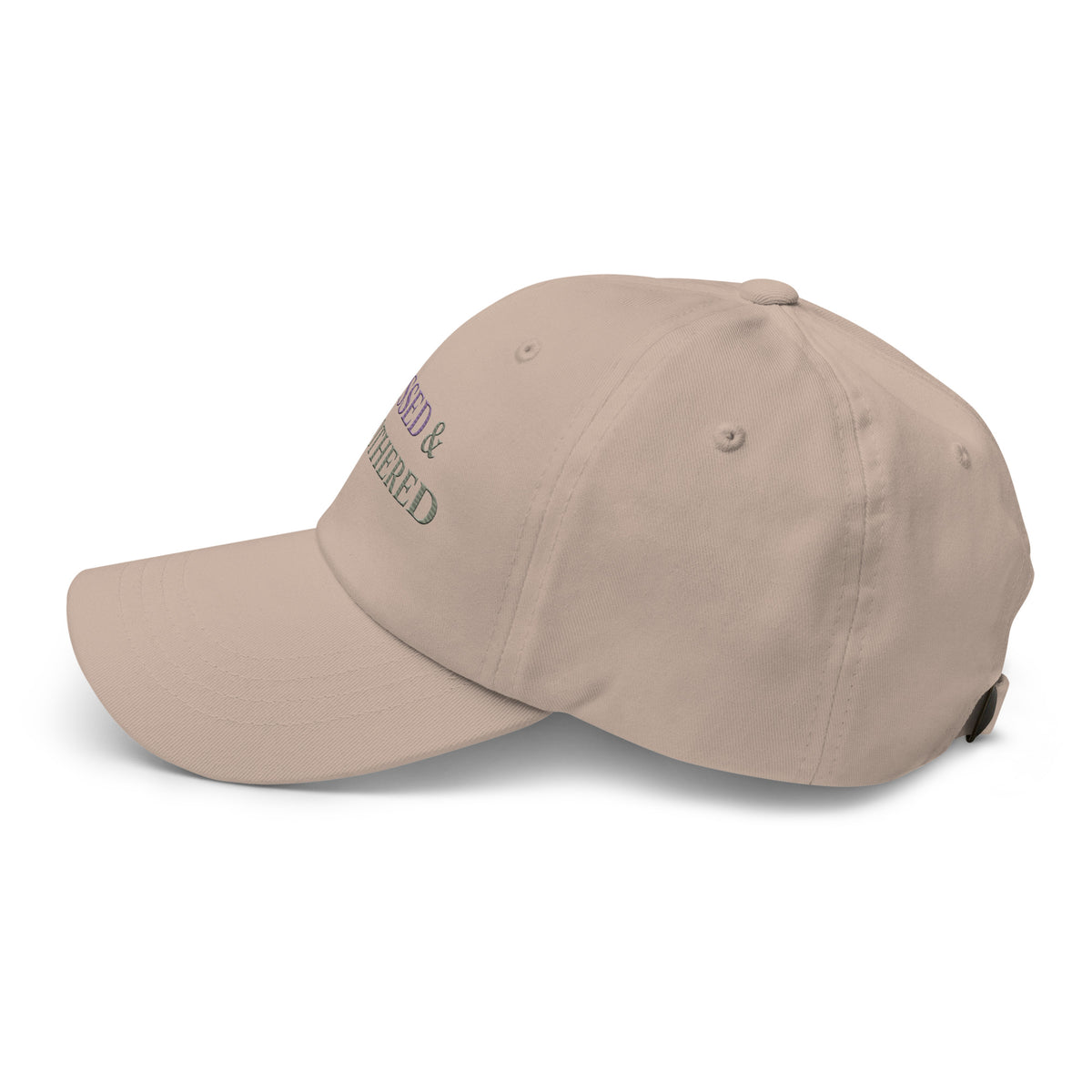 side view of sage green embroidered dad hat with “blessed and unbothered” text in purple, minimal casual accessory
